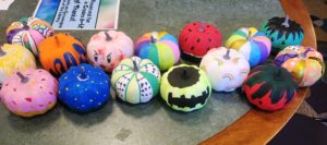 photo of painted artificial pumpkins